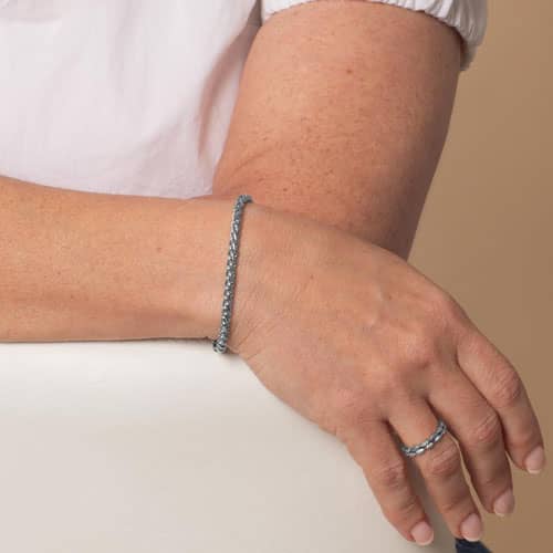 Silver-tone wheat chain medical ID bracelet worn on the wrist.