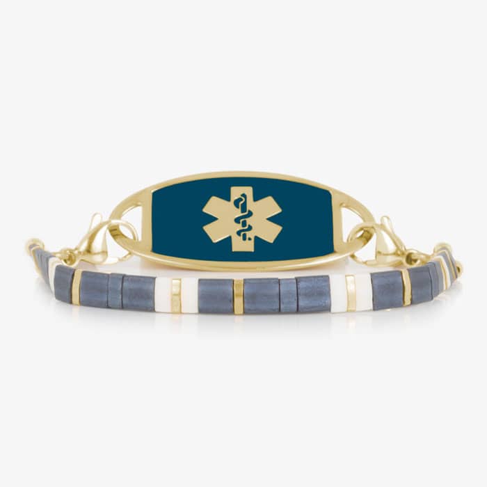 Gold-tone medical ID bracelet with a deep blue sapphire-colored tag and Star of Life, paired with blue, white, and gold tile beads.