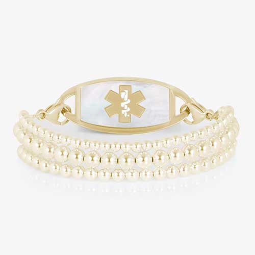 Gold Tilly medical ID bracelet with three polished beaded strands and a mother-of-pearl Star of Life tag.