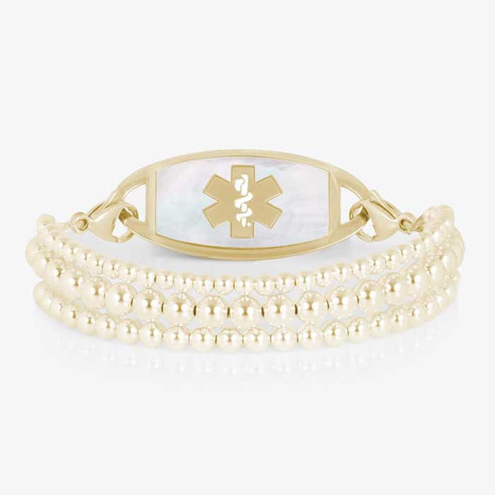 Gold Tilly medical ID bracelet with three polished beaded strands and a mother-of-pearl Star of Life tag.