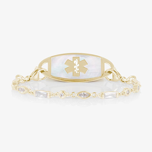 12 karat gold plated med ID tennis bracelet with round, oval, and rectangle clear cubic zirconia crystals and decorative med ID tag.