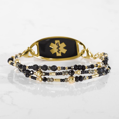 Cher Medical Alert Bracelet featuring triple strands of black agate, tourmaline, and gold accents, perfect for a striking medical ID accessory