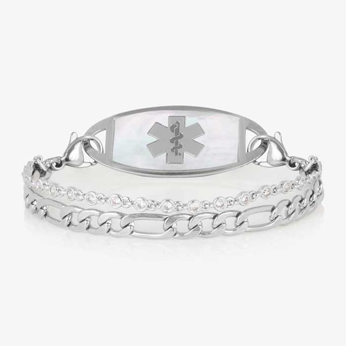 Silver toned two strand bracelet featuring a classic figaro chain, and a dainty, round CZ chain. All attached to a silver medical ID tag featuring inlaid Mother of Pearl and a silver caduceus.