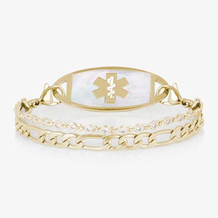 Gold toned two strand bracelet featuring a classic figaro chain, and a dainty, round CZ chain. All attached to a silver medical ID tag featuring inlaid Mother of Pearl and a gold caduceus.