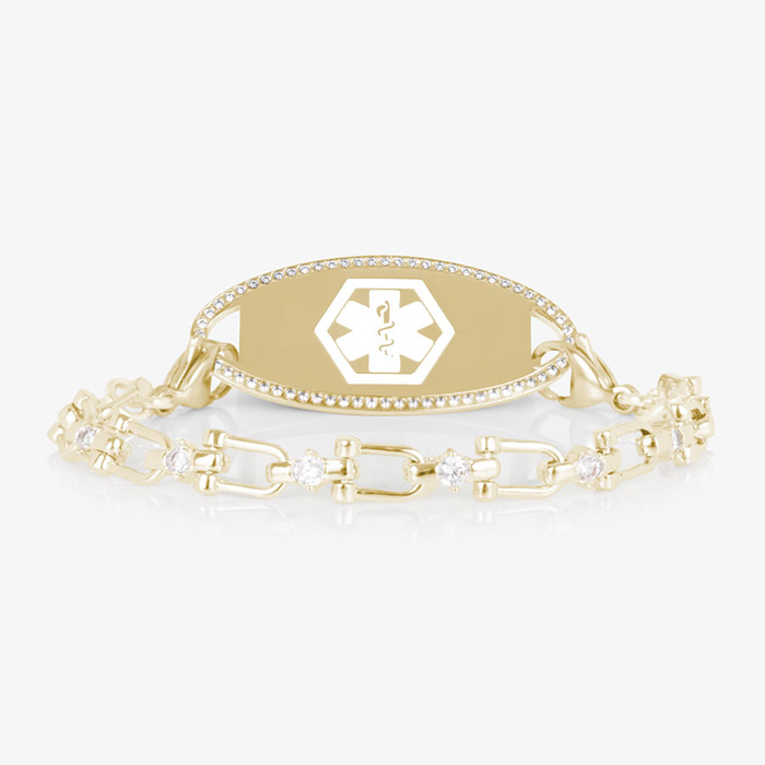Women's medical alert bracelet with 14k gold-plated chain and clear CZ accents, paired with an engravable gold medical ID tag framed in CZs.