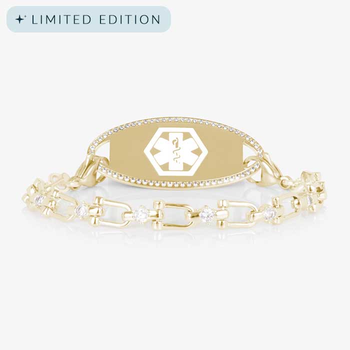 Women's medical alert bracelet with 14k gold-plated chain and clear CZ accents, paired with an engravable gold medical ID tag framed in CZs.