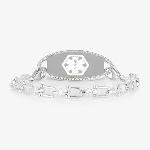 Silver Diana CZ medical ID bracelet featuring a pavé-bordered ID tag and a crystal-accented link chain, shown on white background.