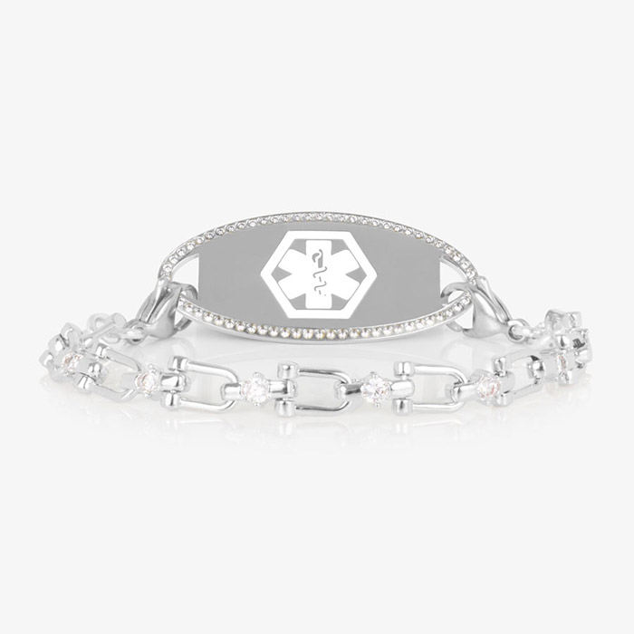 Silver Diana CZ medical ID bracelet featuring a pavé-bordered ID tag and a crystal-accented link chain, shown on white background.