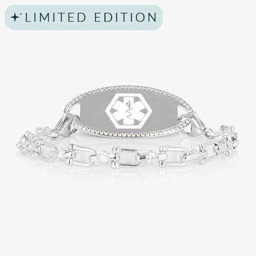 Silver Diana CZ medical ID bracelet featuring a pav&#233;-bordered ID tag and a crystal-accented link chain, shown on white background.