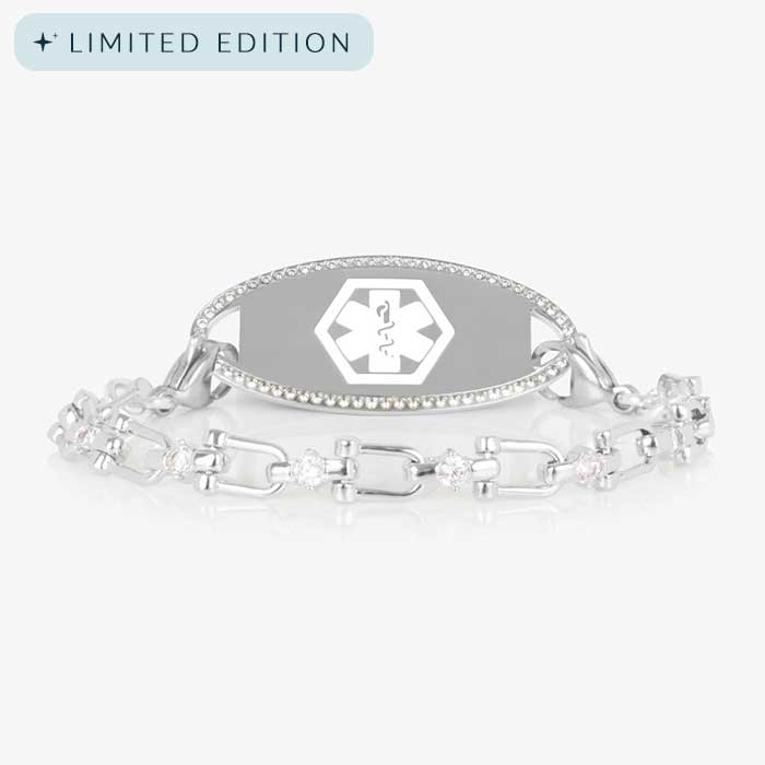 Silver Diana CZ medical ID bracelet featuring a pavé-bordered ID tag and a crystal-accented link chain, shown on white background.