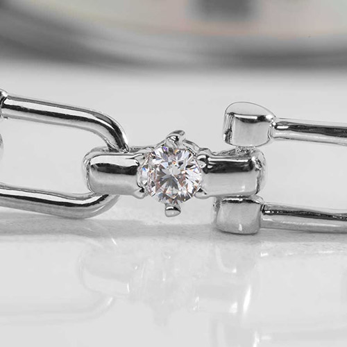 Close-up of silver Diana medical ID bracelet chain link with prong-set cubic zirconia accent from Lauren’s Hope.