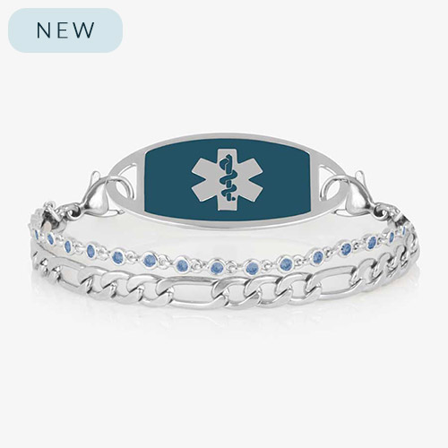 Women&#39;s silver medical alert bracelet featuring sapphire-blue emblem tag and light blue crystal accents, combining beauty with lifesaving information.