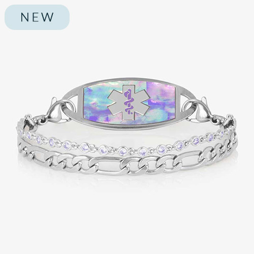 Women&#39;s medical ID bracelet with iridescent lavender opal inlay tag and light purple crystal accents on a double silver chain, engraved with the medical alert symbol.