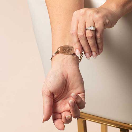 Back view of rose gold medical ID bracelet with custom engraved health information for quick access in emergencies.