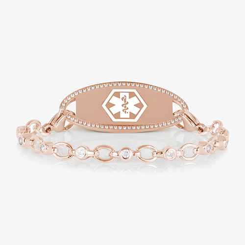 Jovie Medical ID bracelet in rose gold with clear CZs and an oval rose gold ID tag bordered with crystals, featuring a white medical symbol.