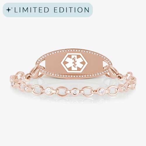 Jovie Medical ID bracelet in rose gold with clear CZs and an oval rose gold ID tag bordered with crystals, featuring a white medical symbol.