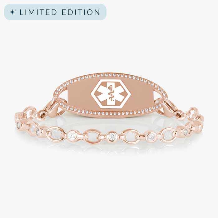 Jovie Medical ID bracelet in rose gold with clear CZs and an oval rose gold ID tag bordered with crystals, featuring a white medical symbol.
