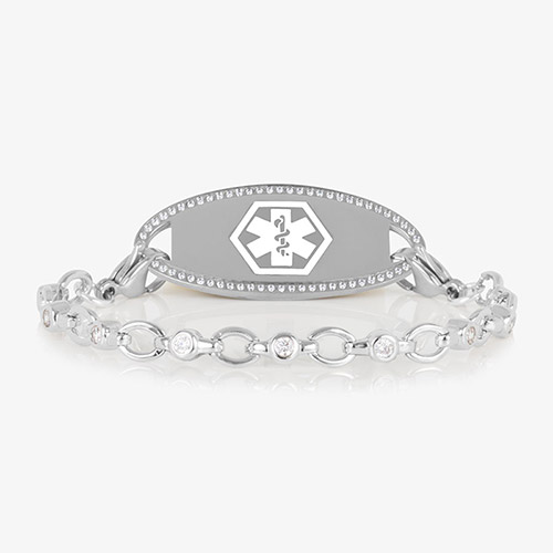 Jovie Medical ID bracelet in silver with clear CZs and an oval silver ID tag bordered with crystals, featuring a white medical symbol.