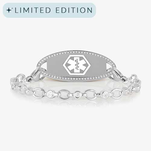 Jovie Medical ID bracelet in silver with clear CZs and an oval silver ID tag bordered with crystals, featuring a white medical symbol.