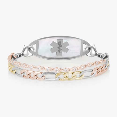 Silver-tone medical ID bracelet with a mother-of-pearl emblem plate, crystal-accented chain, and mixed-metal gold and rose gold links.