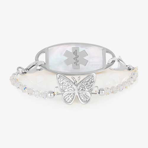 Silver medical ID bracelet with butterfly crystal strand and mother-of-pearl alert tag featuring the Star of Life symbol.