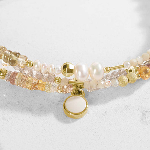 Interchangeable Leighton Beaded Medical ID Bracelet in Citrine and Pearl with a white and gold round charm, ideal for pairing with Lauren’s Hope medical ID tags