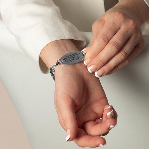 Phoebe Medical ID Bracelet in Silver, shown on wrist, featuring shimmering crystals and pearls in a layered design