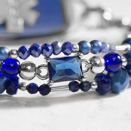 Detail image of watery deep blue centerpiece bead on beaded medical alert bracelet