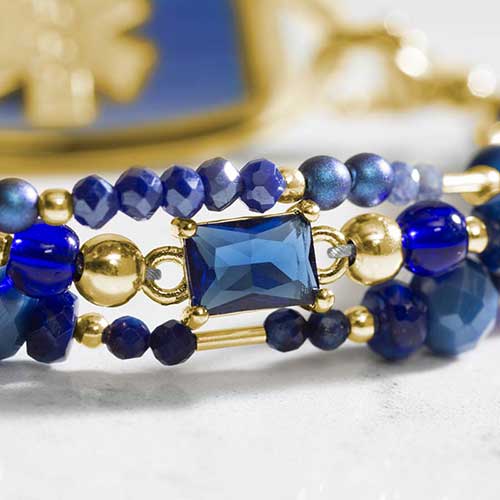 Detail image of watery deep blue centerpiece bead on beaded medical alert bracelet