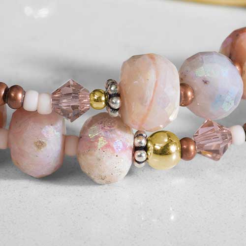 Close up of Peruvian opals, natural stones, sterling silver, gold accents.