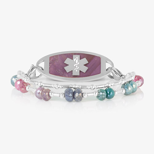 Two Strand bracelet featuring silver filled bead and faceted moonstone crystals, attached to a silver tone medical ID tag featuring warm pink stone inlay and a silver caduceus.