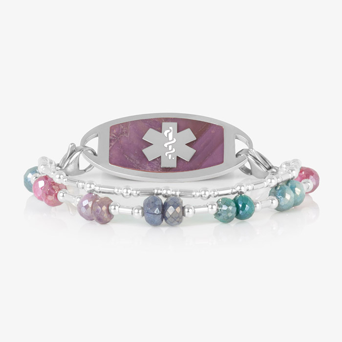 Two Strand bracelet featuring silver filled bead and faceted moonstone crystals, attached to a silver tone medical ID tag featuring warm pink stone inlay and a silver caduceus.