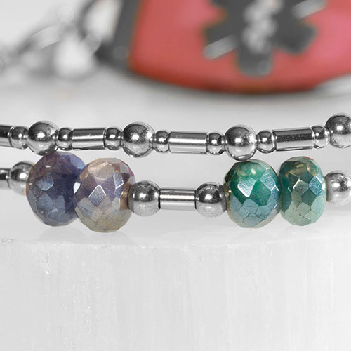 Close up of two Strand bracelet featuring silver filled bead and faceted moonstone crystals.