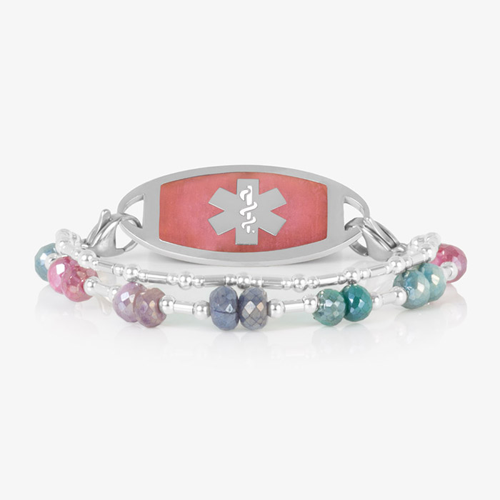 Two Strand bracelet featuring silver filled bead and faceted moonstone crystals, attached to a silver tone medical ID tag featuring warm pink stone inlay and a silver caduceus.