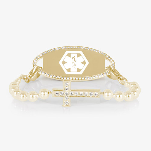 Gold medical ID bracelet with CZ-accented border and cross charm, displayed on a white background