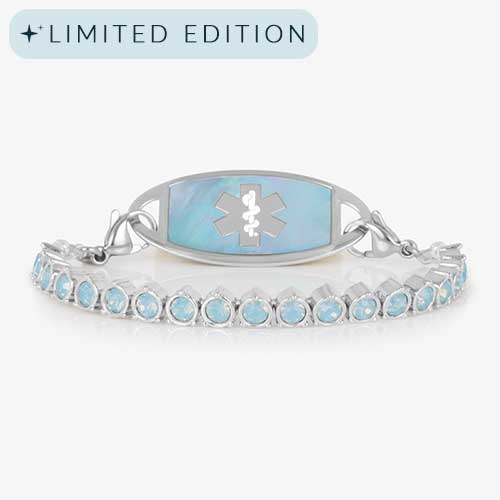 Straight-on product image of a silver medical ID bracelet with iridescent blue opal stones and a matching ID tag featuring a silver medical caduceus symbol.