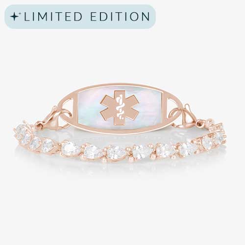 Jackie Rose stretch medical ID bracelet featuring 14k rose gold plating, pear-cut CZs, and a white mother-of-pearl tag with engraved medical symbol, shown on a white background.
