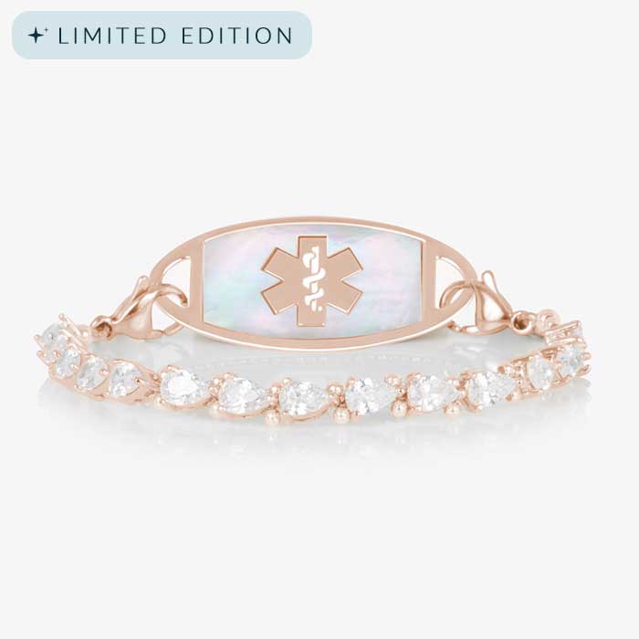 Jackie Rose stretch medical ID bracelet featuring 14k rose gold plating, pear-cut CZs, and a white mother-of-pearl tag with engraved medical symbol, shown on a white background.