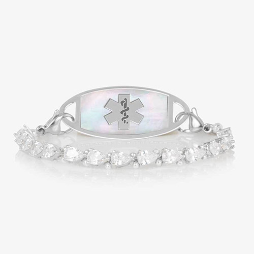 Rhodium-plated stretch medical alert bracelet with pear-cut CZ stones and white mother-of-pearl tag engraved with medical symbol, shown on clean white background.