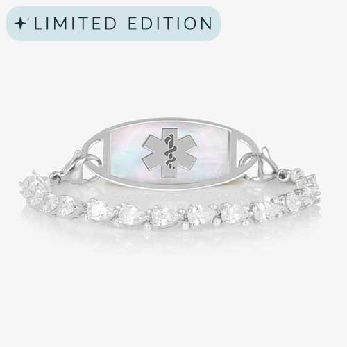 Rhodium-plated stretch medical alert bracelet with pear-cut CZ stones and white mother-of-pearl tag engraved with medical symbol, shown on clean white background.
