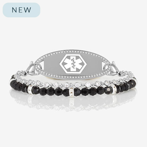 Two-strand medical ID bracelet in silver featuring a sleek oval medical ID tag with a border of clear crystals.