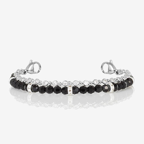 Close-up of the interchangeable bracelet strap with faceted black beads and bezel-set clear crystals, finished with lobster clasps on each end.