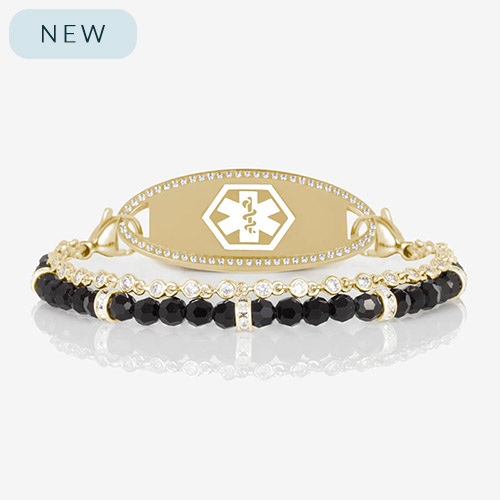 Gold medical ID bracelet with dual strands of faceted black beads and bezel-set crystals, featuring a crystal-accented medical alert tag from Lauren’s Hope.