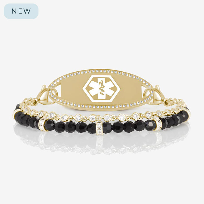 Gold medical ID bracelet with dual strands of faceted black beads and bezel-set crystals, featuring a crystal-accented medical alert tag from Lauren’s Hope.