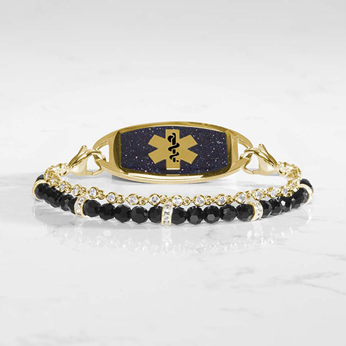 Charlotte medical ID bracelet in gold with black faceted beads and crystal accents, shown with a matching gold and black glitter medical ID tag.