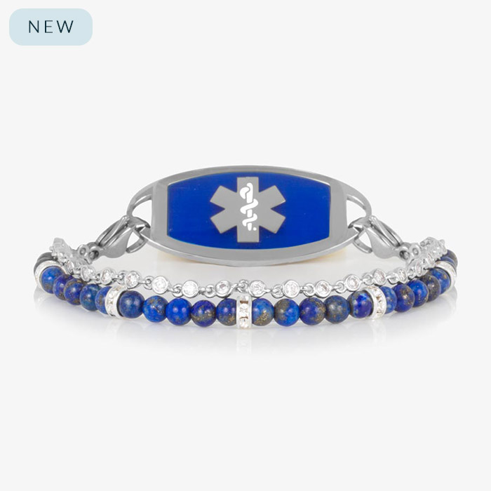 Lauren’s Hope double-strand medical ID bracelet featuring royal blue lapis beads and sparkling crystal accents, paired with a sleek silver ID tag with a bold blue inlay and white medical caduceus symbol.