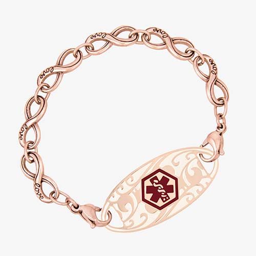 Rose gold tone infinity chain bracelet with "love" inscription on each link paired with decorative med ID tag with red symbol.