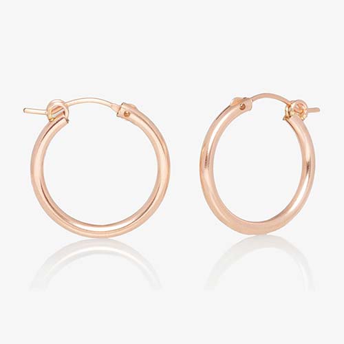 Rose gold tone hoop style earrings.