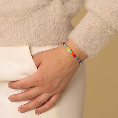 Woman wearing tropical color stretch medical ID alert bracelet