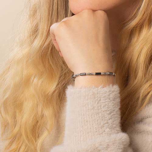 Sterling silver Bali beads and tubular hematite beaded bracelet shown on wrist